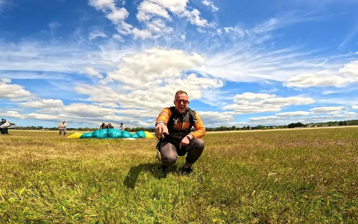 A canopy spread out on the grass of the landing field